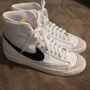Nike White High-Top Sneakers with Black Swoosh